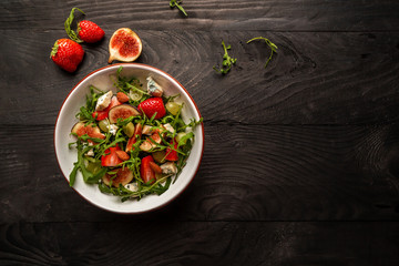 vegetarian salad with figs, strawberries, grapes, blue cheese dorblu. banner, catering menu recipe place for text, top view
