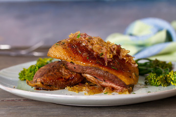 Duck breast fillets with caramelized onion and broccoli