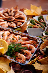 Shrimps and mussels on wooden table