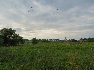 photo of a Russian large field above a cloudy sky