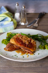 Duck breast fillets with caramelized onion and broccoli