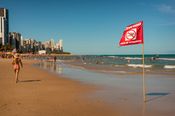 Recife beach with Swimming Forbidden, Risk of Drowning sign, Brazil