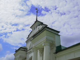 photo of the entrance gate tower above a cloudy sky