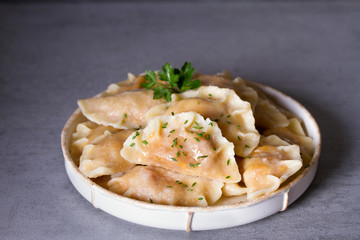 Dumplings, filled with cabbage. Varenyky, vareniki, pierogi, pyrohy - dumplings with filling