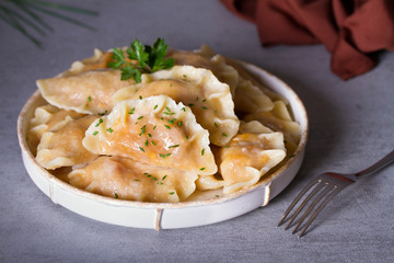 Dumplings, filled with cabbage. Varenyky, vareniki, pierogi, pyrohy - dumplings with filling