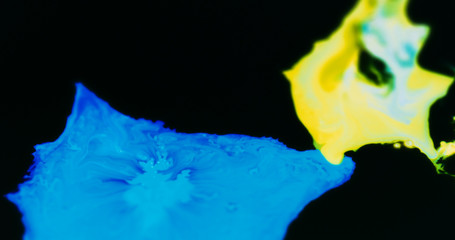 Macro Paint with Neon Color Palette. Oil Mixed with Bright Blue and Yellow Dye and Paint.