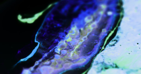 Macro Paint with Neon Color Palette. Oil Mixed with Blue and Purple Dye and Paint. Green Highlights.