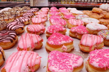 colorful heart shaped donuts on the market
