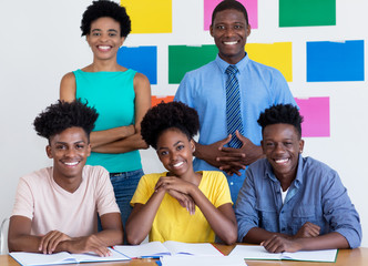 Group photo of african american students with male and female teacher