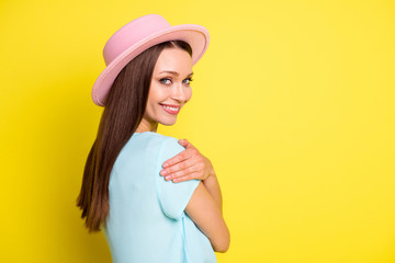 Profile side photo of positive lovely girl hug embrace herself enjoy comfort cozy cuddle copyspace wear good look clothes isolated over vibrant color background