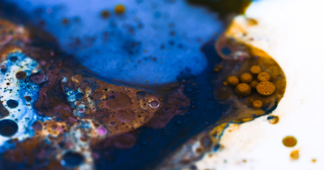 Closeup Paint with Vibrant Color Palette. Oil Mixed with Dark Blue and Orange Dye and Paint.