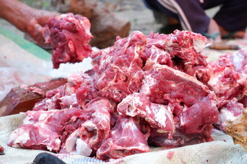 Fresh red beef is cut into small pieces to celebrate the Muslim holiday, Eid al-Adha