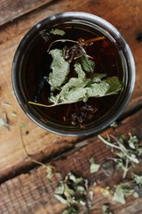 Useful tea with herbs on the table