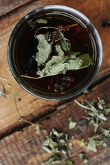 Useful tea with herbs on the table
