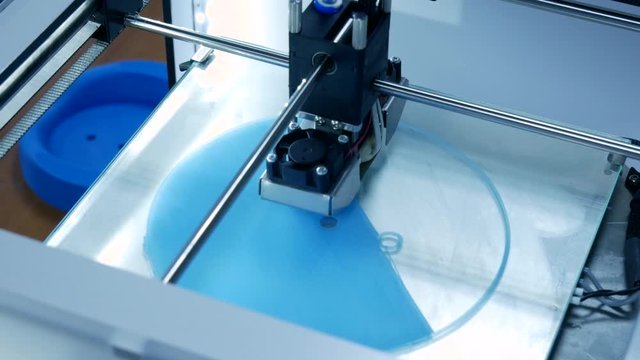 3D printer working close up. Automatic three dimensional 3d printer performs plastic. Modern 3D printer printing an object from the hot molten. Concept progressive additive technology for 3d printing.