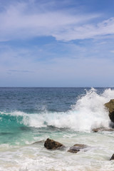 Suwehan beach on Nusa Penida Island, Bali, Indonesia. Amazing  view, white sand beach with rocky mountains and azure lagoon with clear water of Indian Ocean 