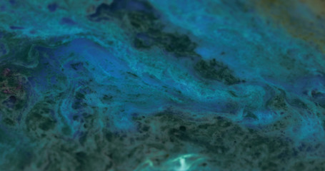Obraz premium Macro Paint with Vibrant Color Palette. Oil Mixed with Deep Blue Dye and Paint.