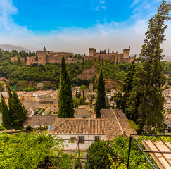 A view from the Albaicin district towards the Alhambra Palace in the distance in Granada in the summertime