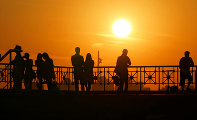 group of people at sunset