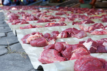 Fresh red beef is cut into small pieces to celebrate the Muslim holiday, Eid al-Adha