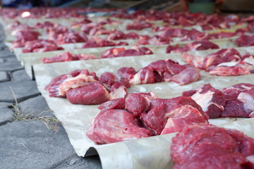 Fresh red beef is cut into small pieces to celebrate the Muslim holiday, Eid al-Adha