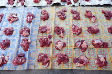 Fresh red beef is cut into small pieces to celebrate the Muslim holiday, Eid al-Adha