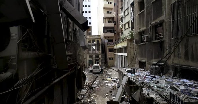 2020 Beirut port explosion: streets aftermath of destruction, devastation, destroyed buildings ruined by ammonium nitrate blast in downtown, mar Micheal, dolly in