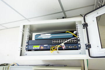Network switch and ethernet cable connect to computer.