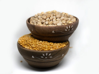 White Chick Pea and yellow lentils isolated in wooden bowl on White Background