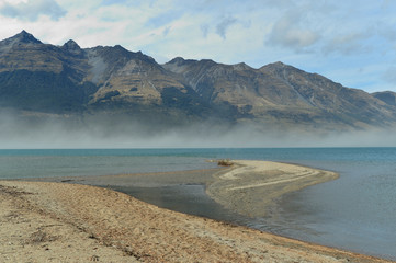 Fototapeta na wymiar Mountain lake clouds and view of New Zealand in spring season