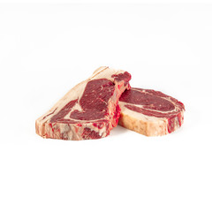 Matured beef chops, two fillets , photograph taken on pure white background, for e-commerce. front view