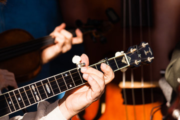 Banjo fret board being played