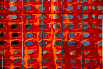 Close up view of red protective mesh. Abstract background