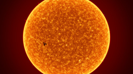 sun with International Space Station