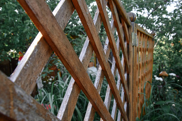 wooden fence in the garden at their summer cottage