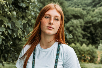 Close-up portrait of young teen freckled ginger girl