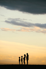 Silhouette of a Family on the beach