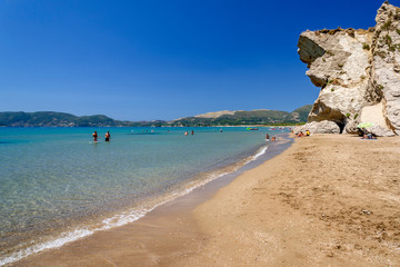 Picturesque golden sandy beach in Kalamaki situated on Laganas bay of Zakynthos island on Ionian Sea, Greece.