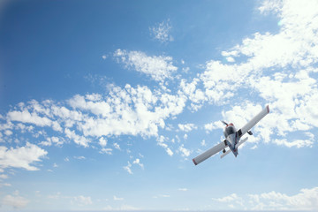 Fototapeta na wymiar Small airplanes do air acrobatics over Bronnoysund Airport