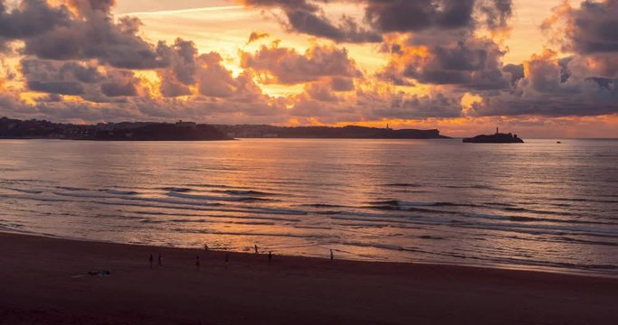 Views of Santander during sunset in Summer. Beach and Santander city in the background during beautiful sunset
