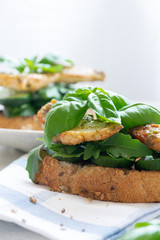 Ready to eat sandwich with grilled chicken meat and basil pesto