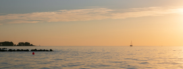 Fototapeta na wymiar picturesque coastline with sail boat, panorama