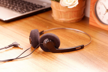 Vintage retro headphone on wooden background, gadgets for The 70-80-90's