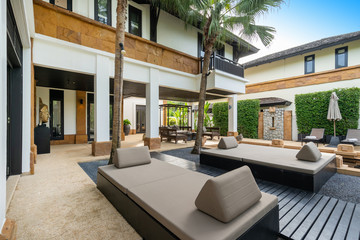 Plakat Exterior design of house, home and villa feature sun bed, palm tree, umbrella and outdoor shower on pool terrace