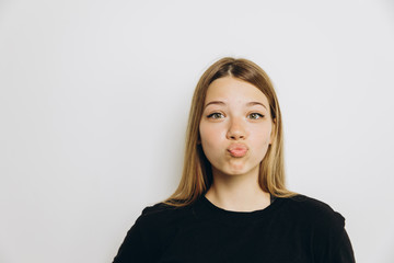 Fototapeta premium A teenage girl against grey background with copy space