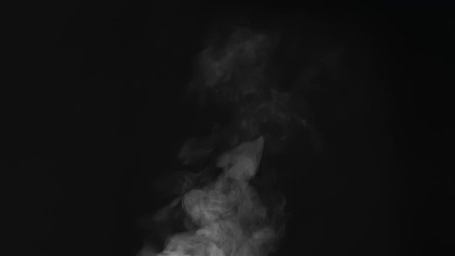 Steam Flow Deviates to the Rright. White Steam rises from a large pot that is behind the scenes. Black background. Filmed at a speed of 240fps