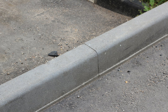 Curb on the street asphalt road.