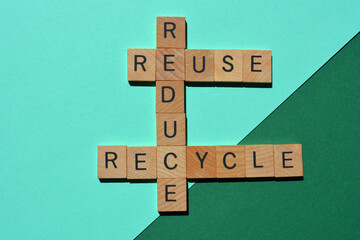 Obraz premium Reduce, Recycle, Reuse, words in wooden alphabet letters in crossword form isolated on green and turquoise background