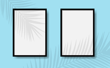 Black photo frames on a blue wall with realistic shadows of a palm tree. EPS 10