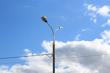 Street lamp post with wires.